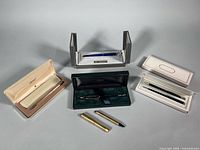Overview of all pens with cases and stand