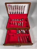 Open chest showing full flatware set in two tiers