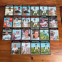 Full layout of 22 vintage 1971 Topps baseball cards on table
