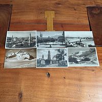 All six postcards laid out showing fronts