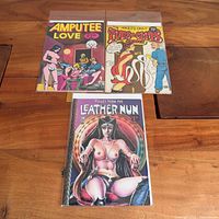 Front covers of all three comic books in sleeves