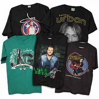 Front view of all five concert T-shirts displaying graphics