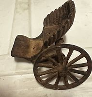 Top view of cast iron buggy seat with wheel