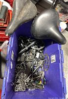 Overall view of bin showing two saddles, chain and mixed parts