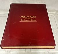Front view of red hardcover book showing title text