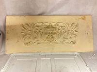 full view of rectangular carved wooden panel