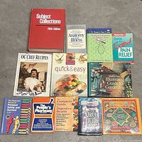 All twelve books laid out face up for identification and condition review