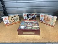 Front view showing large 10-puzzle set box and three individual 300-piece puzzles