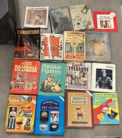 Front view showing all sixteen books laid out in four rows