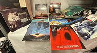 Assorted LaserDisc movies laid out on table