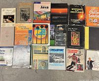 Front view showing all 18 books laid out in three rows