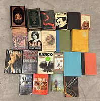 All 21 books arranged on floor, spines and covers visible