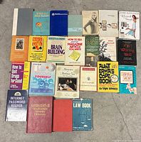 All 25 books laid out on floor