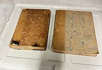 Both antique books showing covers and wear