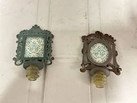 Both wine stoppers side by side showing overall design, colors and stopper bases