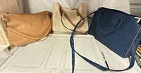 All three handbags front view
