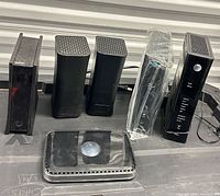 All six modems lined up showing fronts and tops