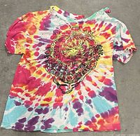 Front view of tie-dye Liquid Blue Grateful Dead T-shirt showing graphic and wear