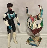 Front view of both items showing relative size and painted details