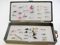 Open fly box showing 39 flies in foam inserts