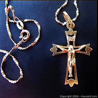 Twisted serpentine chain with spring ring clasp attached to crucifix pendant