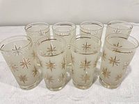 Front view of all eight Dominion Atomic Starburst glasses