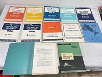 All catalogs and manuals spread on tabletop