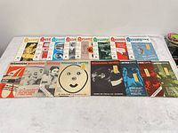 All 16 magazine issues laid out in two rows