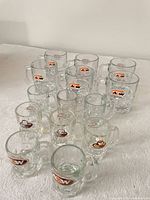 All 14 mugs group shot showing two sizes and logo variations