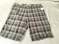 Full view of Calvin Klein plaid dress shorts front