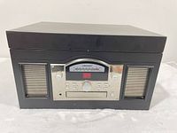 Front view of Crosley record player showing speakers and control panel