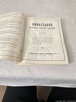Title page of Ambassador World Stamp Album by H.E. Harris & Co.