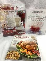 Three cookbooks laid out: Southern Living 2019 Annual Recipes, Countdown to a Cozy Christmas, Instant Pot Holiday