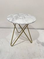 Full view of round faux marble accent table