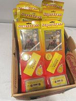 Box containing multiple sealed Supercross Fever souvenir packages