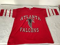 Front of red Atlanta Falcons long-sleeve shirt laid flat