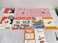 Overview of all manuals, catalogs and booklets laid out on table