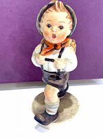 Front view of figurine showing full pose and colors