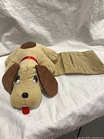 Full view of corduroy dog remote holder showing fold-out pocket section