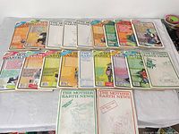 Twenty magazines laid out face up showing covers and spines