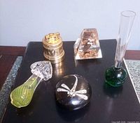 Group view of all five items on black surface