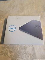 Front of sealed Dell DW316 retail box showing product image and Dell logo