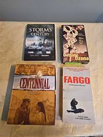 Front view of four movie titles with cases