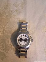 Front view of Guess watch showing dial, bezel and bracelet