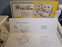 Front of retail box and unfolded instruction sheet with diagrams