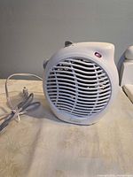 Front view of white homeMAX FH901-D3 fan heater showing grille, power indicator and cord