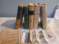 Group shot of all books, pamphlet, foldout