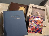 All four photo albums showing assorted covers and sizes