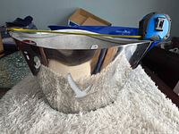 Stainless steel Grey Goose ice bucket, tape measure showing length