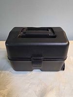 Front view of closed cooler showing handle and latch